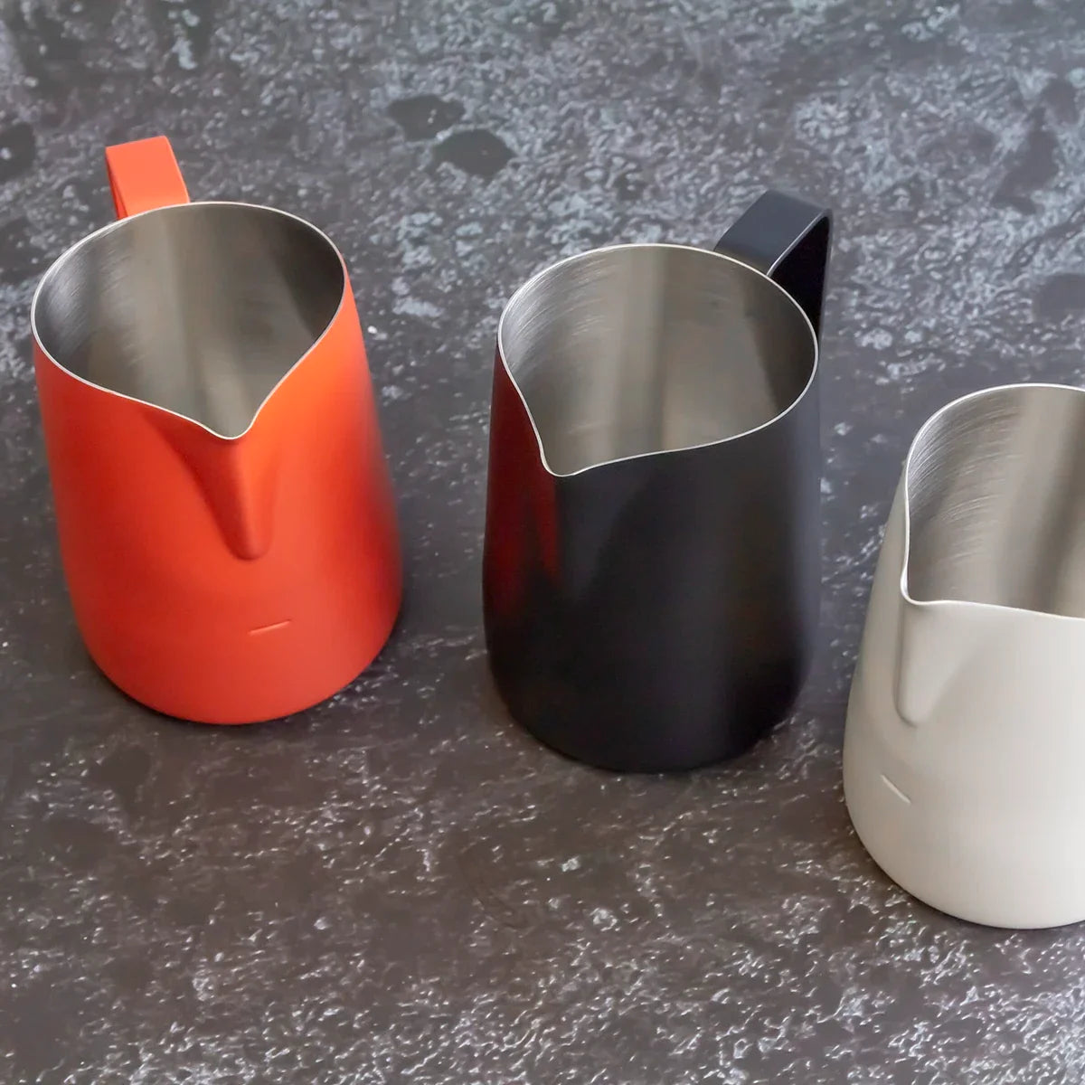 Real WPM milk pitchers with sharp narrow spouts