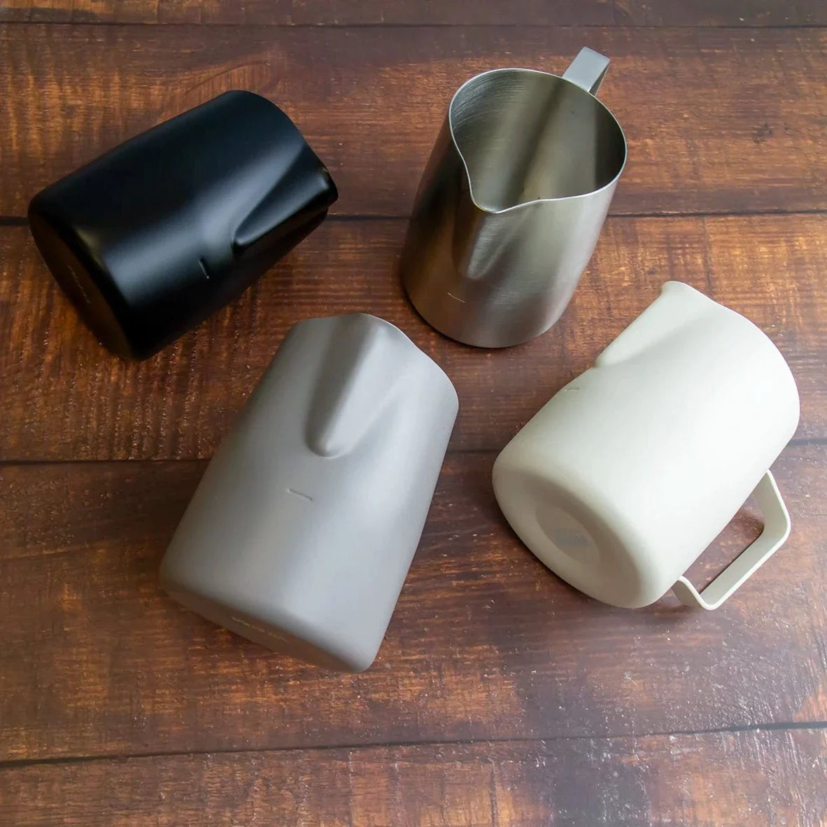 Real WPM milk pitchers with extra-round wide spouts